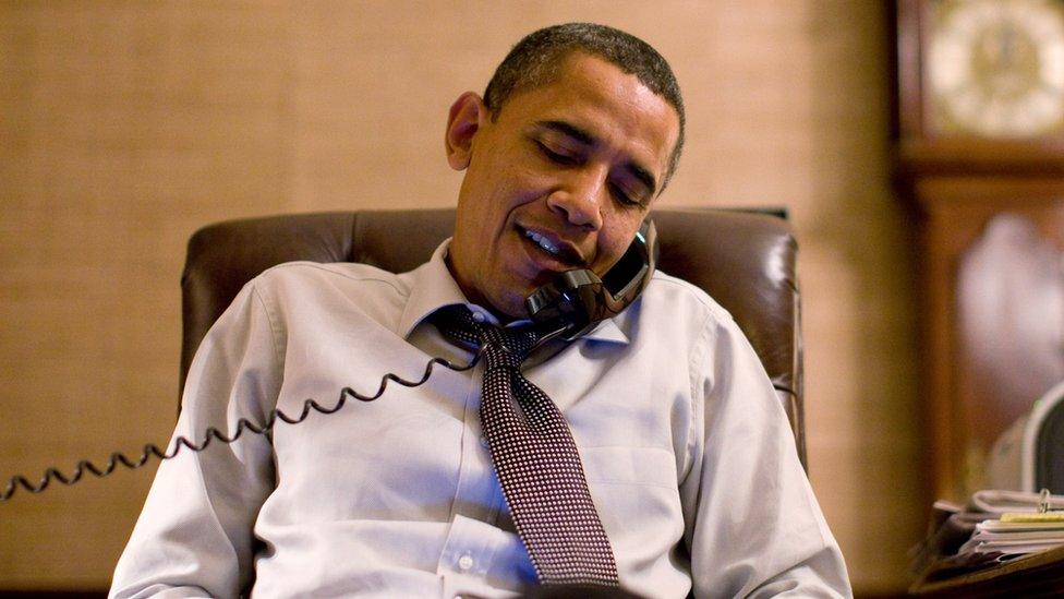 Barack Obama on the phone in the White House