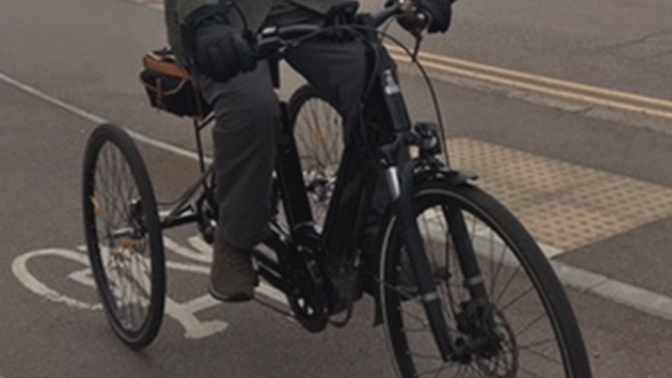 Man on electric tricycle