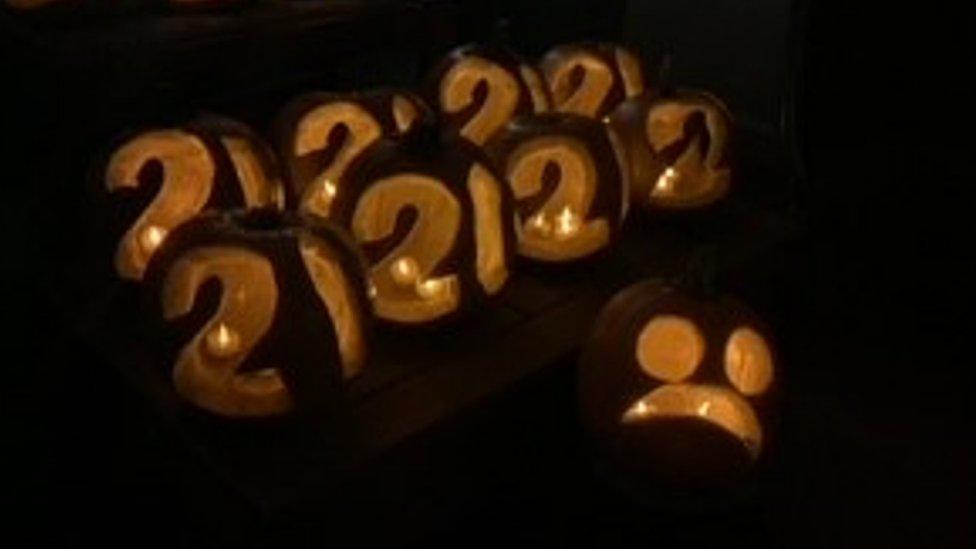 Pumpkins carved with the number 20