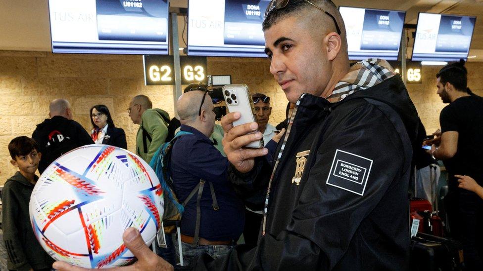 Fans queue at check in counters