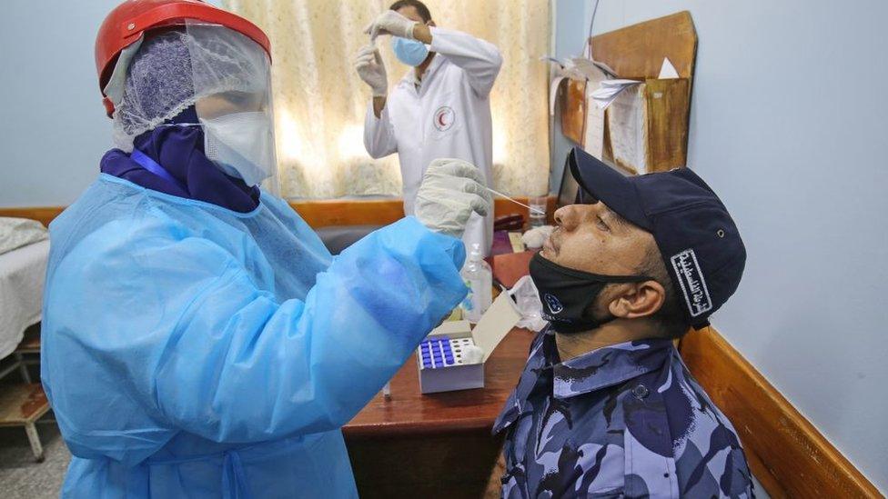 Hospital staff tested for coronavirus in Rafah in the southern Gaza Strip on August 31, 2020