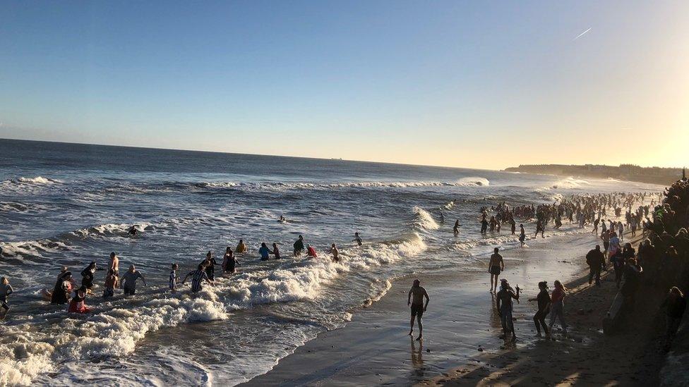 People taking part in a New Year's Day dip at Whitley Bay, North Tyneside