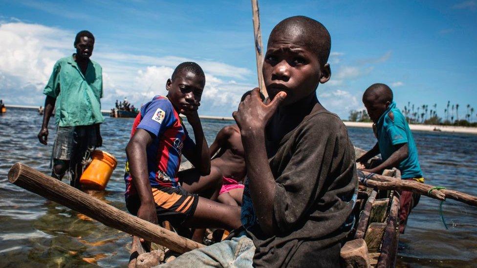 Fishermen return to shore in Palma, northern Mozambique