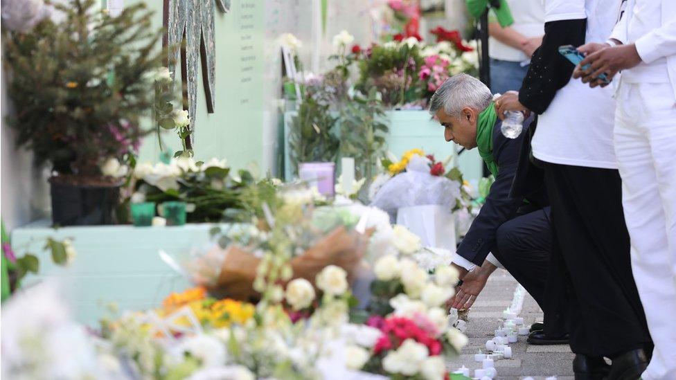 Mayor of London Sadiq Kahn lays a wreath outside Grenfell Tower on the second anniversary of the fire