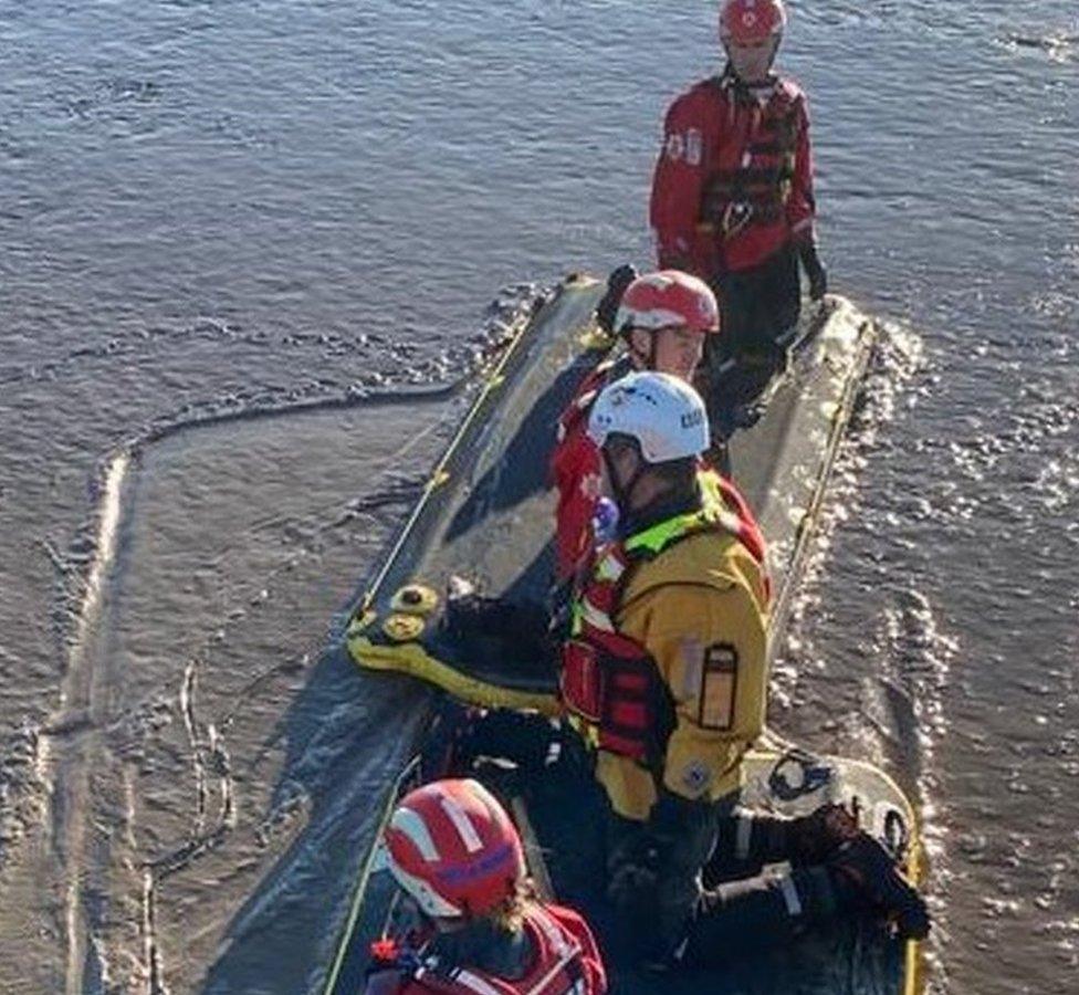 Essex firefighters rescuing a family stuck at mudflats