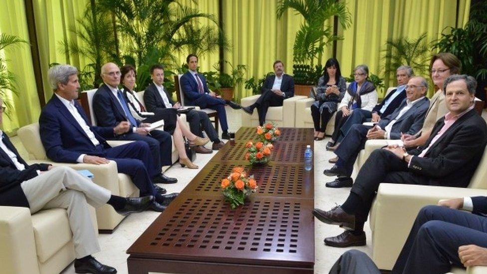 A handout photo released by the High Commissioner for Peace (OACP) of Colombia shows US State Secretary John Kerry (2-L) speaking with Colombian delegates in the peace talks with rebel group FARC as High Commissioner for the Peace Sergio Jaramillo (R) and the head of the delegation of the Colombian government peace Humberto de la Calle (3-R) among others during a meeting in Havana, Cuba, 21 March 2016.