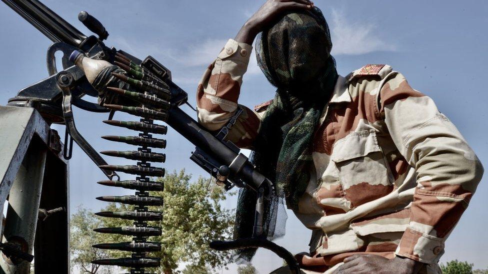 Niger Army soldier takes a breather during security patrol near the Nigerian border in Maradi State