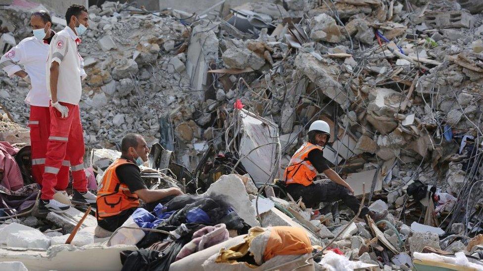 Search and rescue work continues at debris of a building after air strikes by Israel in al-Rimal, Gaza