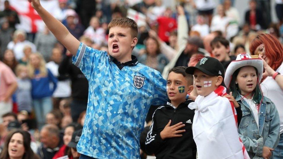 England fans react at Devonshire Green as they watch a screening of the UEFA Women"s Euro 2022 semi-final match between England and Sweden held at Bramall Lane, Sheffield