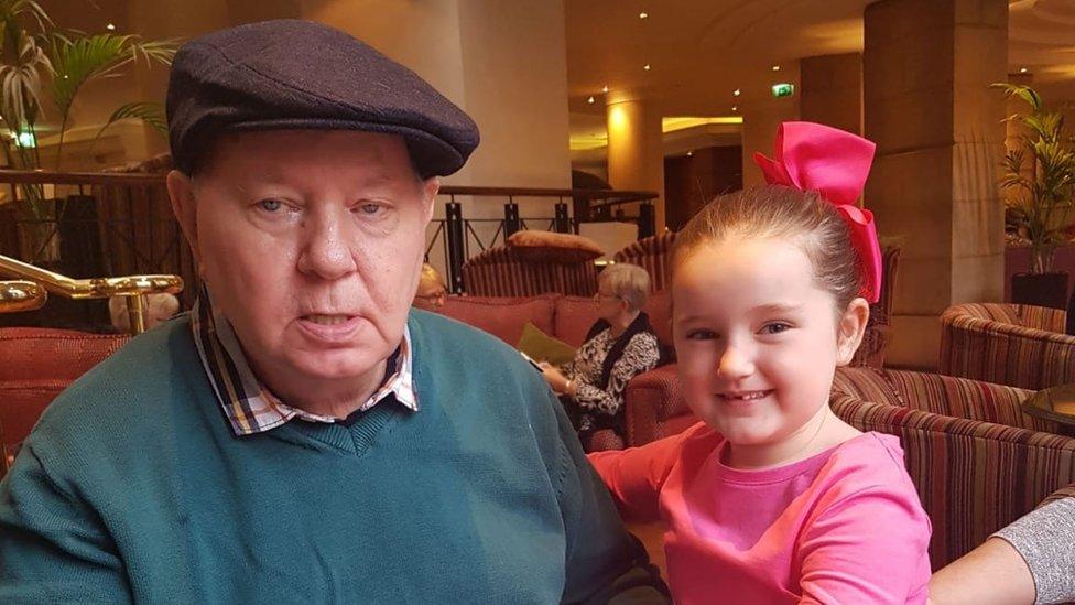 John Duffy with his granddaughter, celebrating his 70th birthday last year