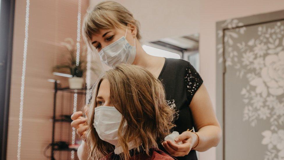 Hairdresser with client