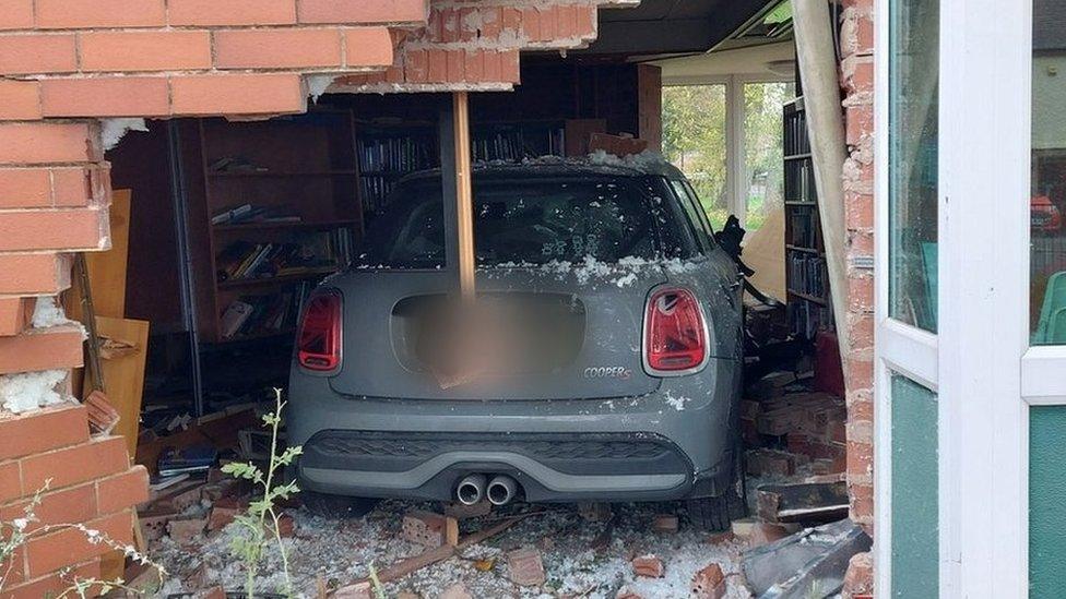 Car embedded in Sandiacre library