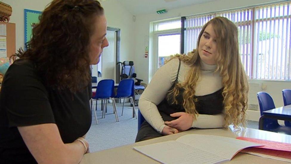 Ellie with her teacher