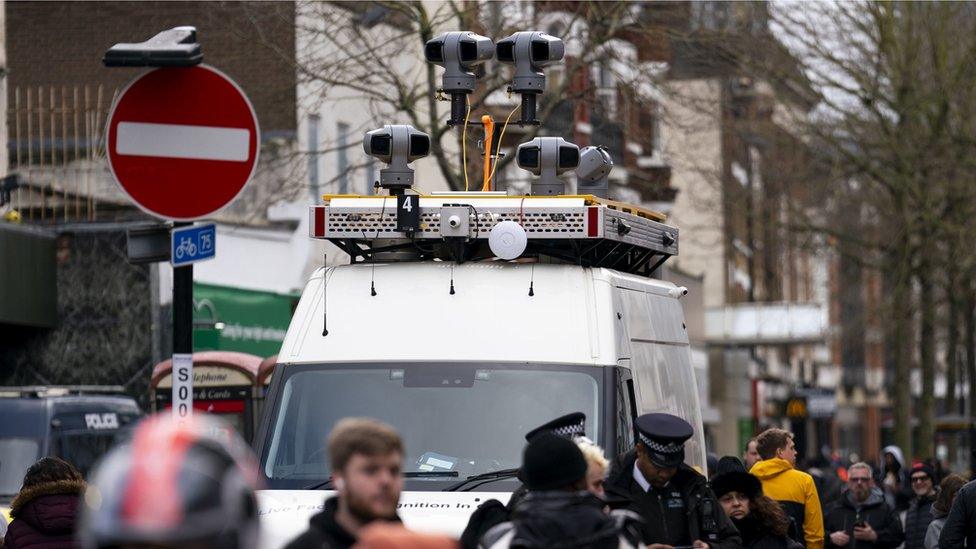 Live facial recognition cameras on top of a white van