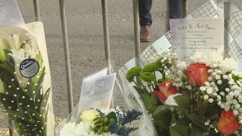 Flowers have been laid at the scene of the shooting