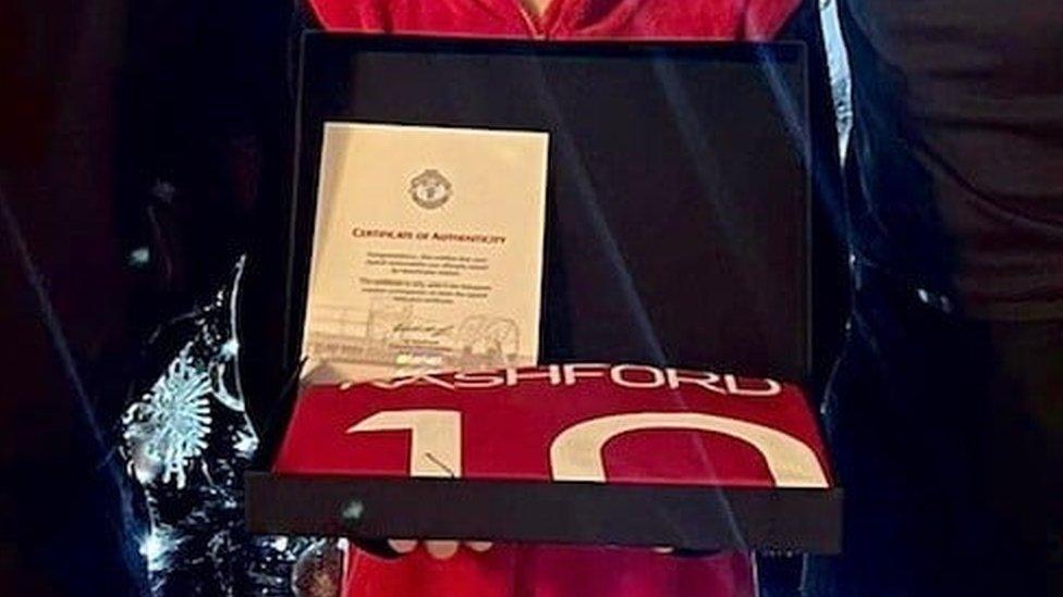 Marcus Rashford shirt in a box