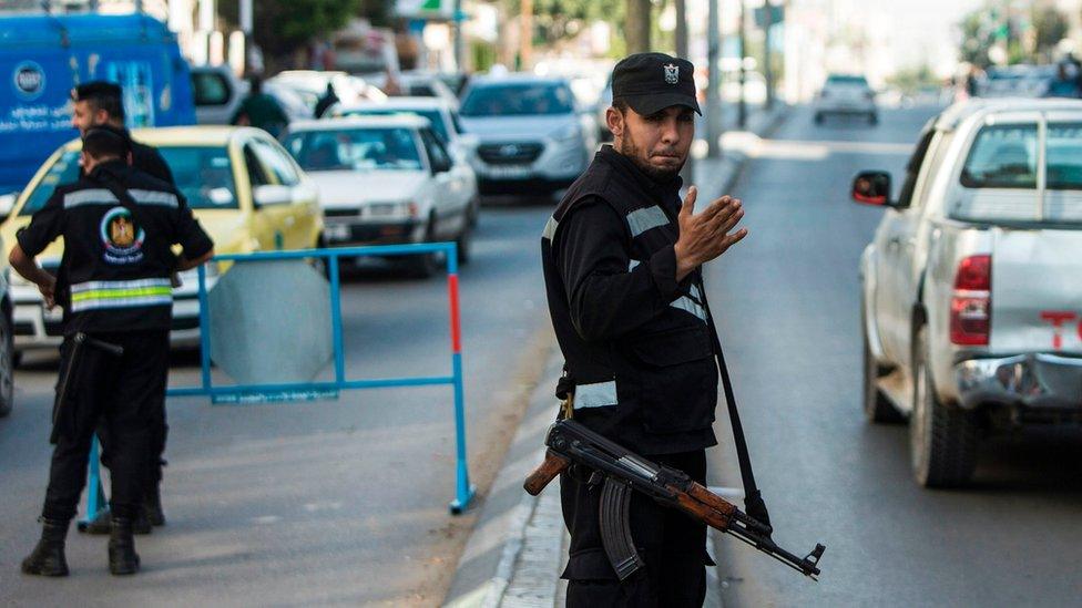 Hamas security forces personnel stand at a security checkpoint in Gaza City on 5 April 2017