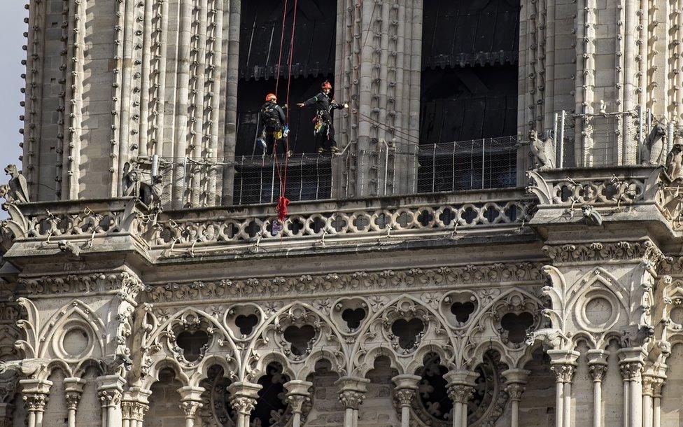 Workers are seen restoring the Notre-Dame cathedral