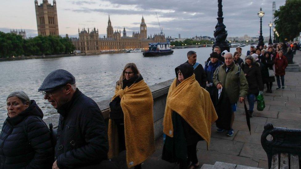 People queue to pay their respects to Queen Elizabeth II lying in state.