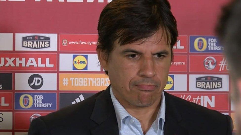 Wales' football manager Chris Coleman observes the silence