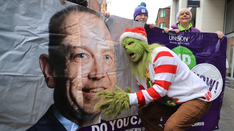 The Grinch with a Unison banner of Chris Heaton-Harris