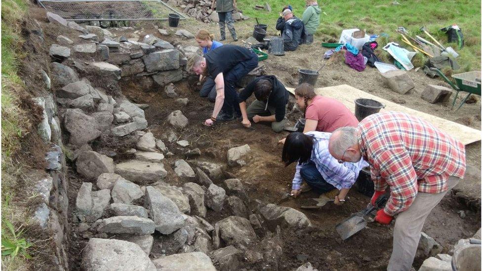 excavation team at Dunyvaig Castle