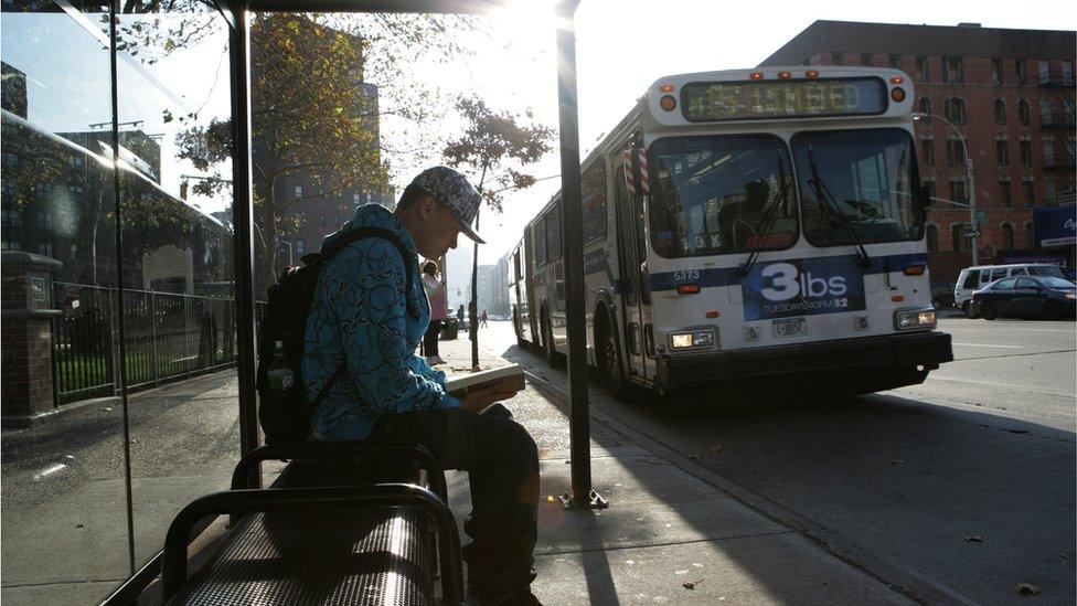 Man waiting at bus stop