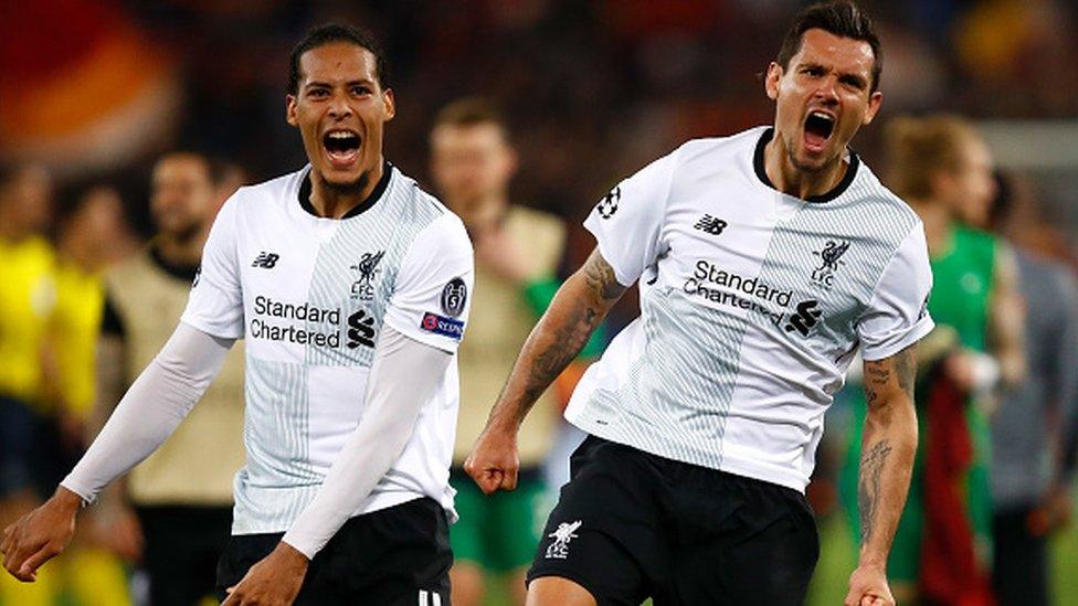 Virgil Van Dijk (L) and Dejan Lovren of Liverpool celebrate their semi final win at full time during the UEFA Champions League Semi Final Second Leg match