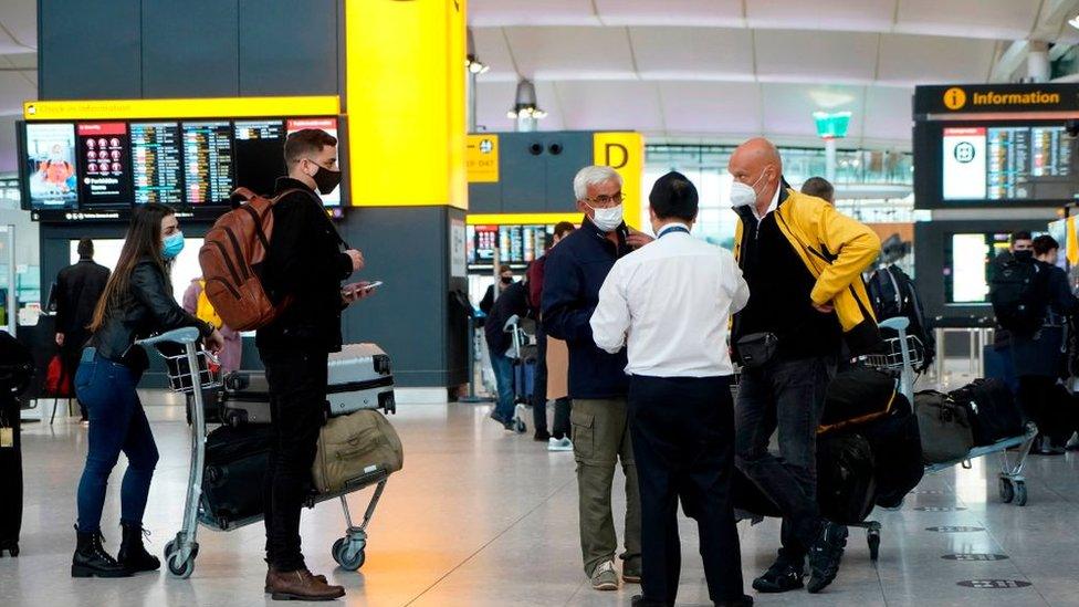 People check in at Heathrow