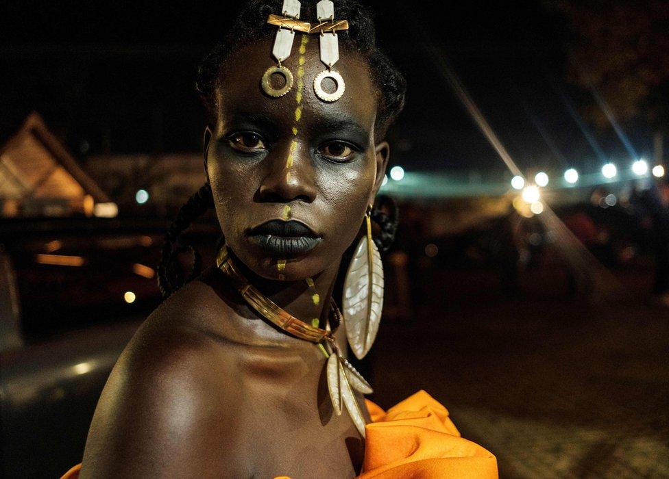 A model poses backstage before Burundi's Margaux Wong collection during the 6th Kampala Fashion Week, the annual showcase of fashion brands from East Africa, in Kampala, Uganda, on September 28, 2019.