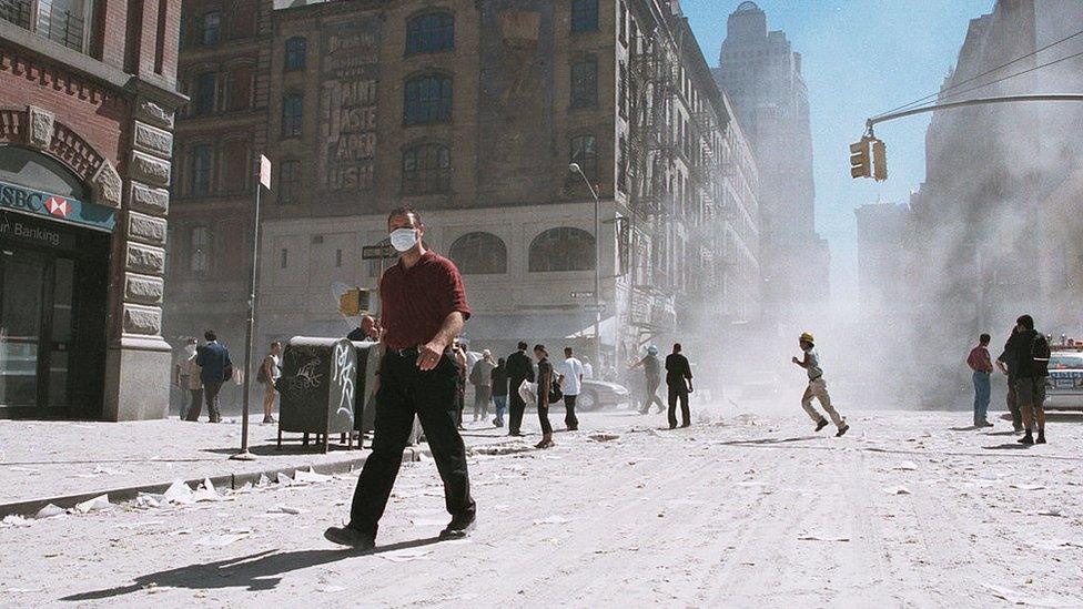 A dust covered street near to where the twin towers collapsed on September 11 2001 .