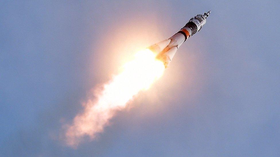 A rocket fires the Soyuz spacecraft up into the atmosphere