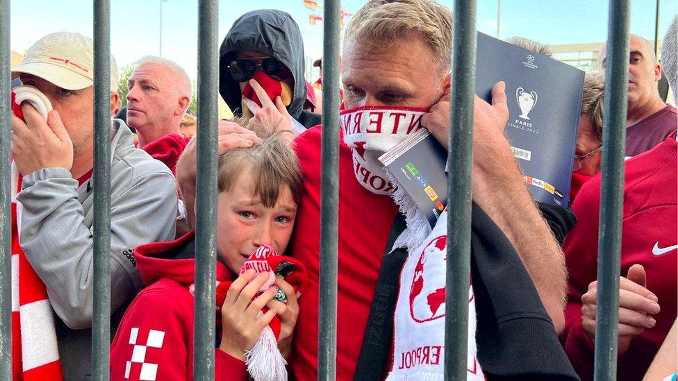 Liverpool fans queue to access the Stade de France stadium in Paris before the Champions League final, 28 May 2022