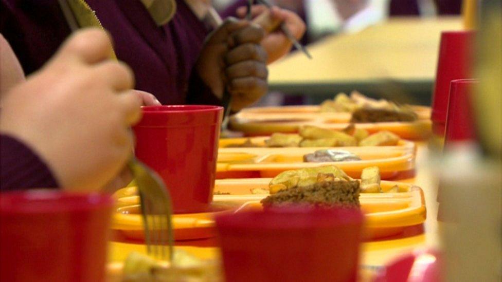 Children eating school dinners