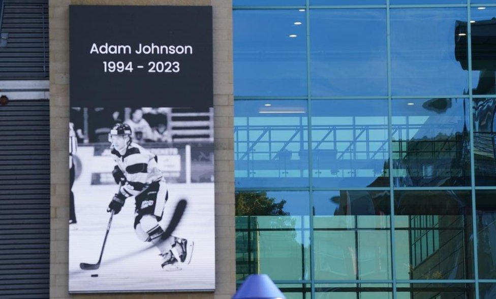 A message board shows a black and white tribute to Nottingham Panthers' ice hockey player Adam Johnson at the Motorpoint Arena in Nottingham