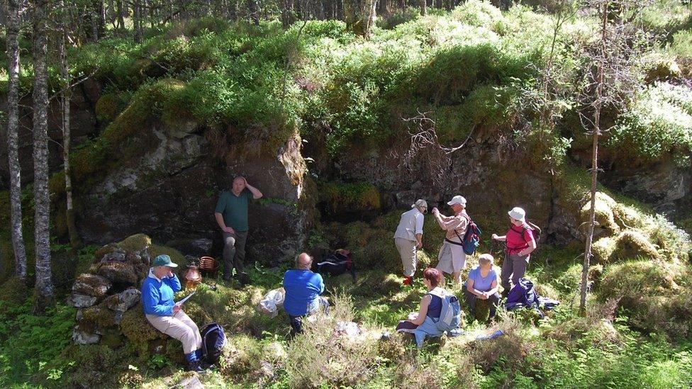 Walkers at the site of the illicit still in Glen Affric