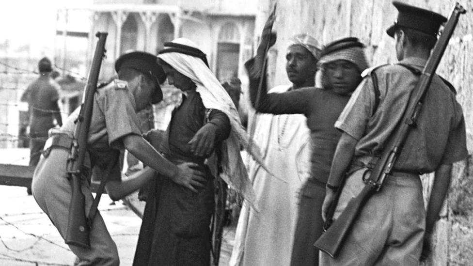 British soldiers search Arabs in Palestine