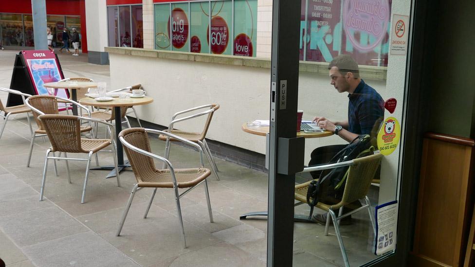 Sam outside coffee shop