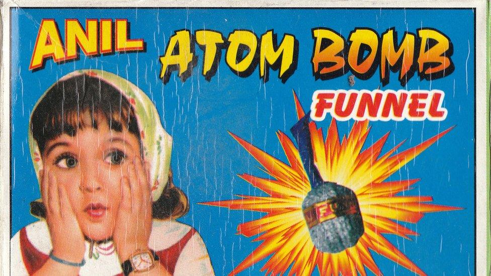 Anil Atom Bomb is advertised with a picture of a small girl next to an exploding fire cracker