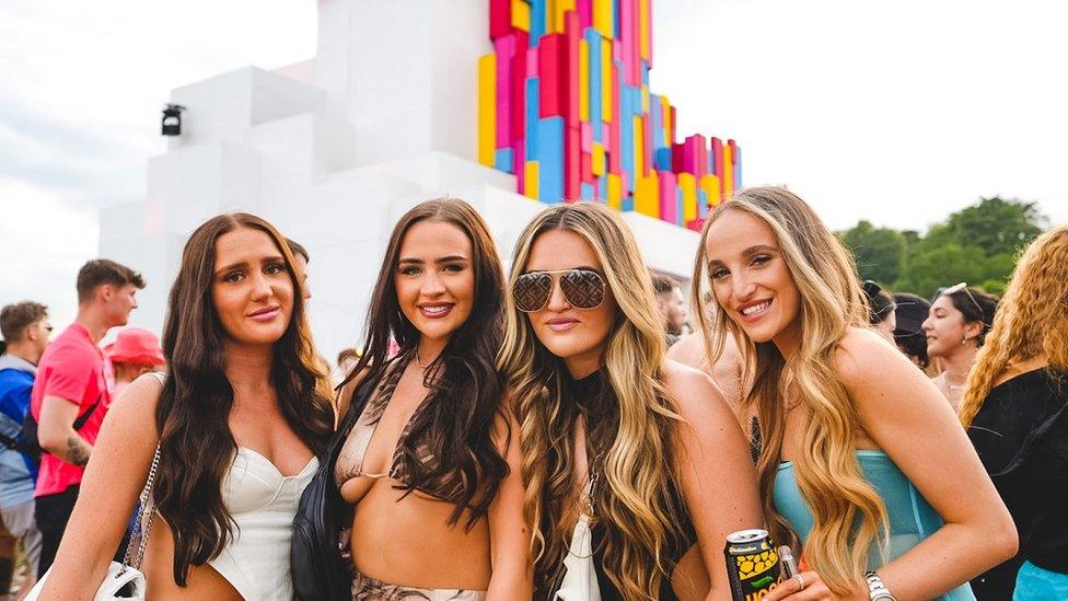 A group of girls pose for the camera at Love Saves The Day