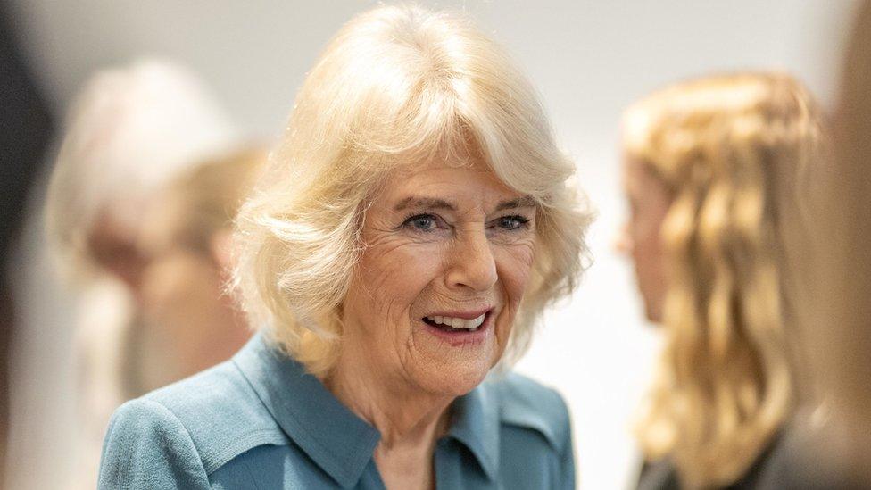 A close up of Queen Camilla smiles during her visit to London's Royal Free Hospital