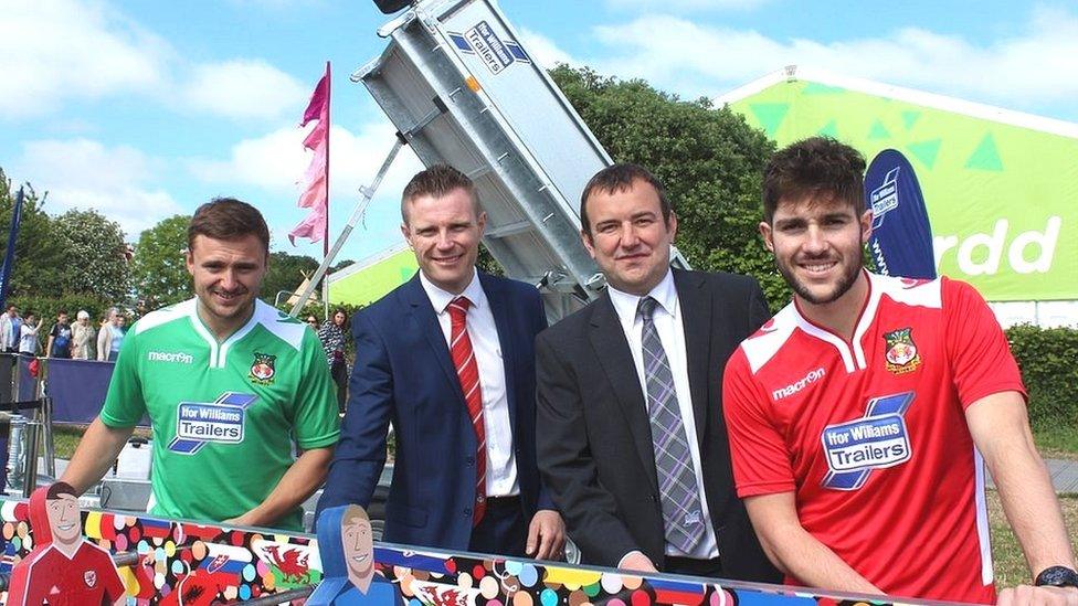 Wrexham players Paul Rutherford and Robbie Evans modelling next season's shirts.