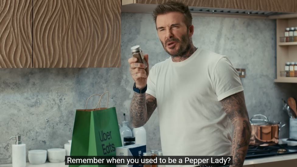 David Beckham holding a jar of pepper