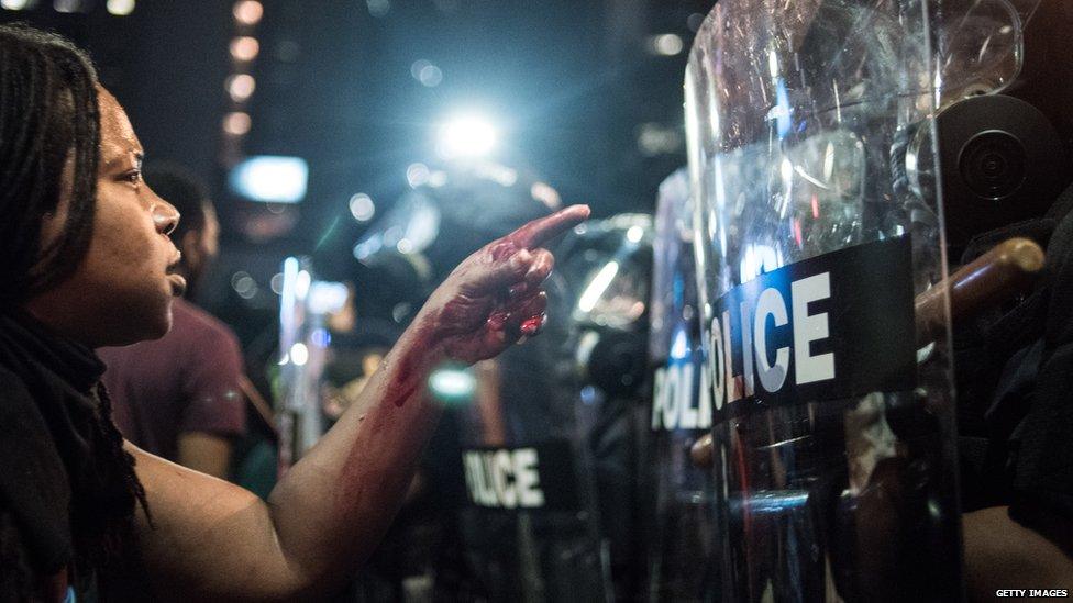 Black Lives Matter protesters shouting at police in the US