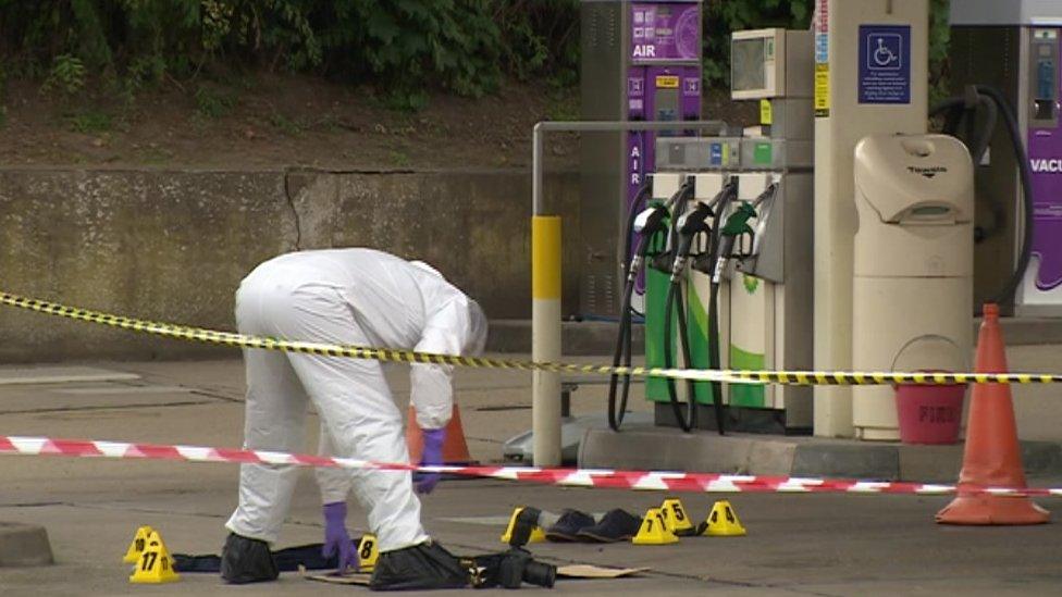 Forensic officer investigates crime scene