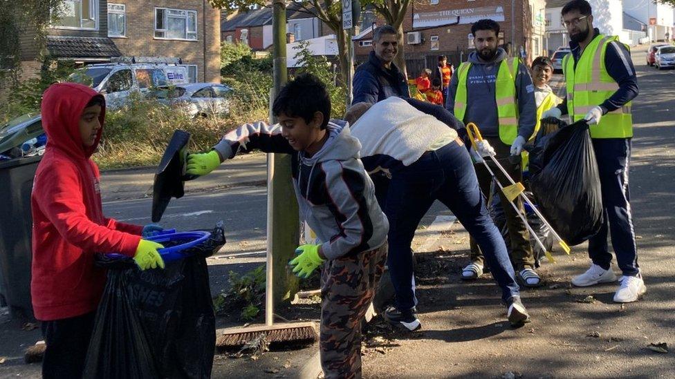 People cleaning up Luton