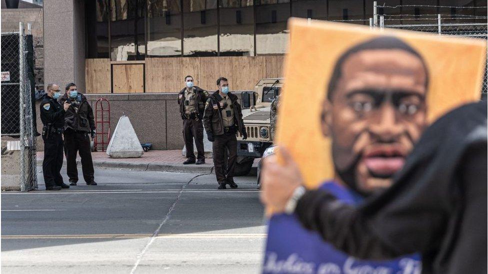 Protester and guard outside courtroom