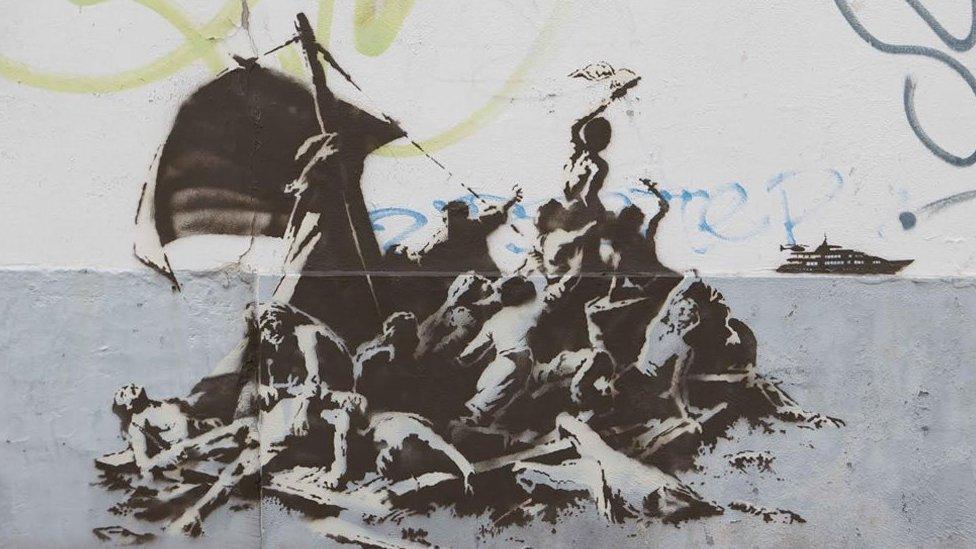 Banksy painted another piece in Calais showing refugees waving to a luxury yacht