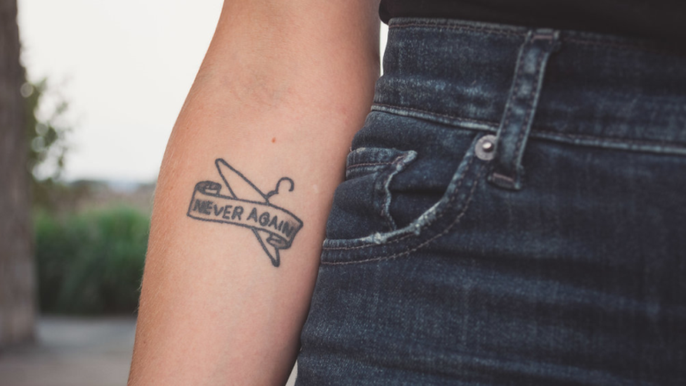 Colleen Krajewski's 'Never Again' tattoo