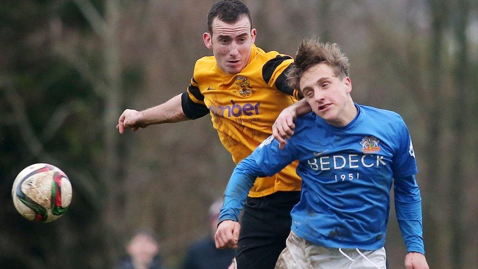 Sammy Devine of H&W Welders in action against Joel Cooper of Glenavon